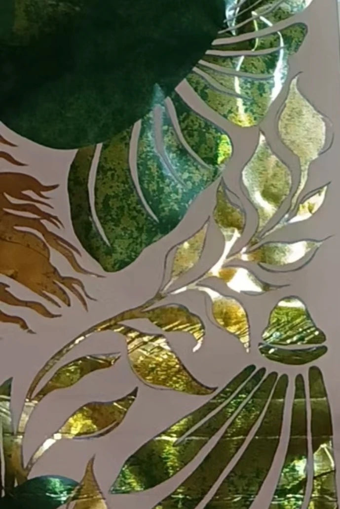 Siren SZN artwork: flowers and leaves over green and gold foil