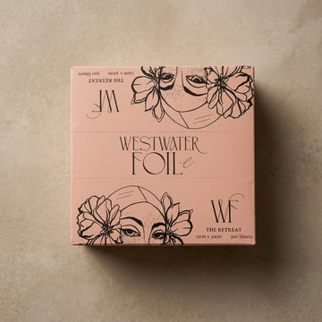 The Retreat hairdressing foil box closed, seen from above, with Westwater Foil Co lettering and the hand-drawn portrait