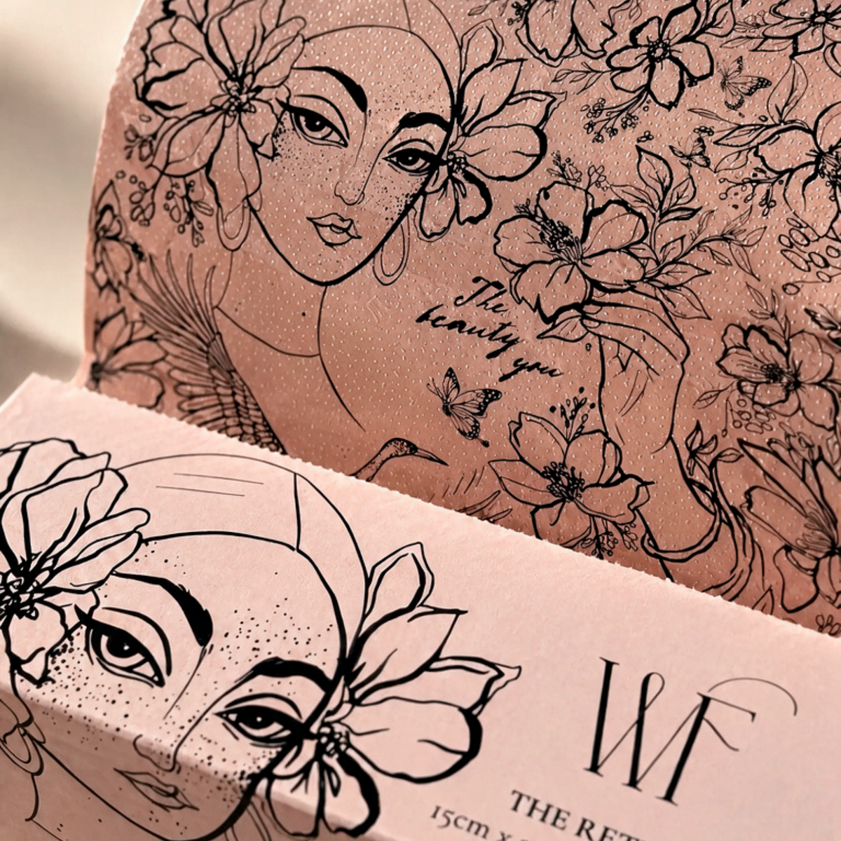 The Retreat pop-up hair foil box open, hand-drawn portrait artwork, with pink butterflies around it