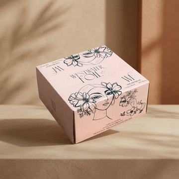 The Retreat box closed on a warm backdrop with the hand-drawn artwork on the lid
